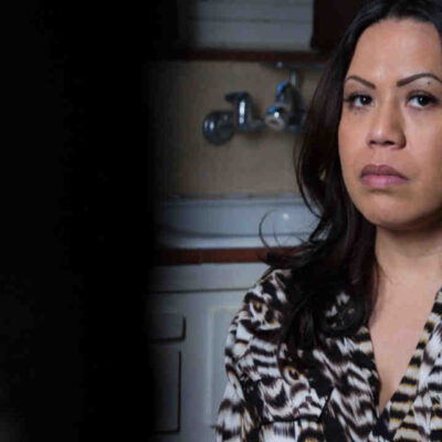 An image of a woman in a kitchen, representing rapid deportations that bypass the courtroom.