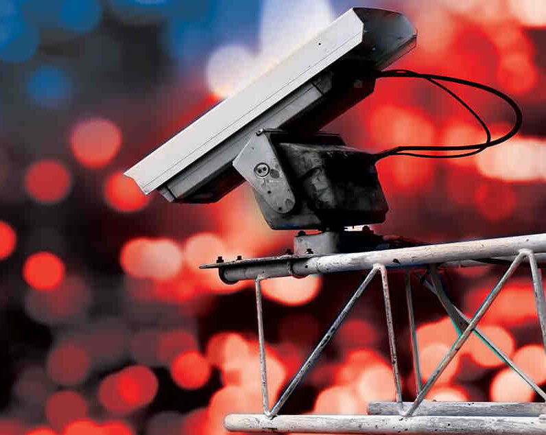 surveillance camera with red and blue lights in the background