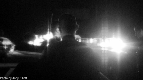 Silhouette of Albuquerque police officer at night