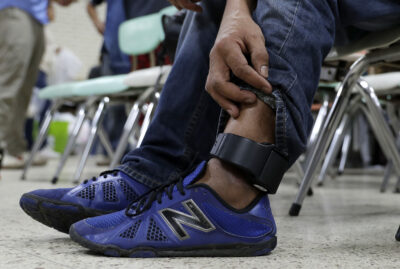 Image of an ankle monitor being worn