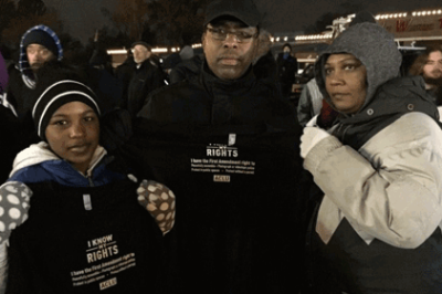 People in Ferguson, holding up our Know Your Rights t-shirts