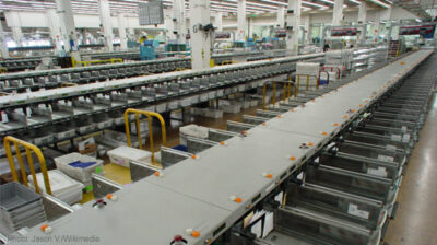 Sorting at a mailroom. Photo source: Jason V. via Wikimedia