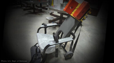 An empty prison restraining chair