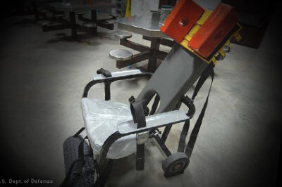 An empty prison restraining chair