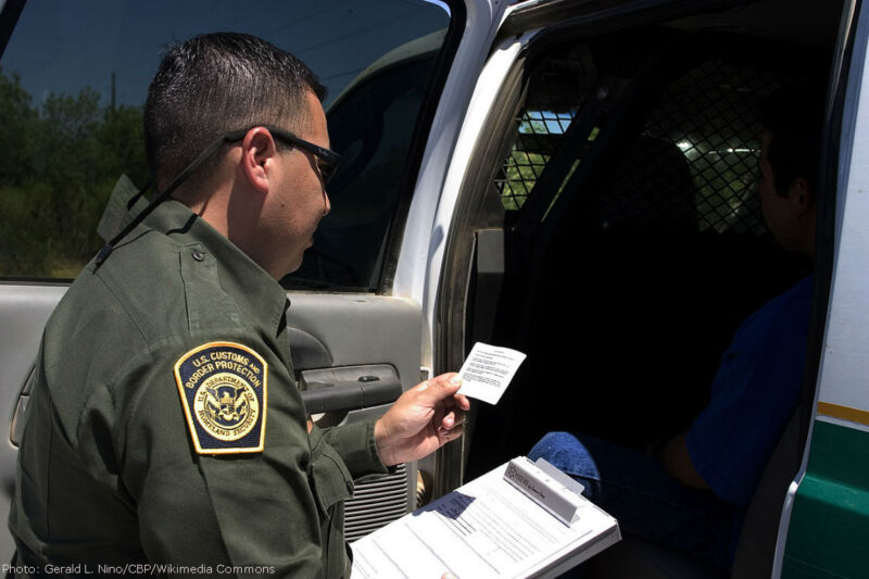 Border Patrol agent reads the Miranda rights to a Mexican national arrested for transporting drugs
