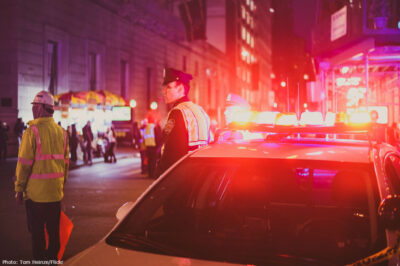 Police officers stand outside their patrol car during Nov. 12, 2016, anti-Trump protests in New York City.