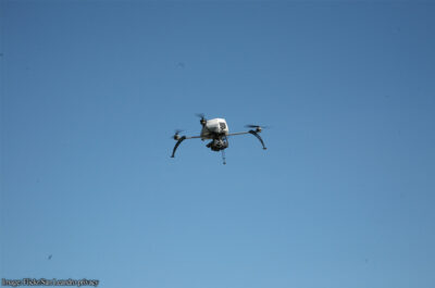 Drone against blue sky