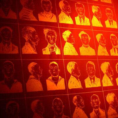 A screen with mug shot images on it