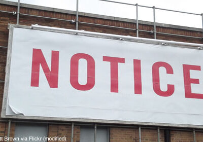 Large billboard reading "notice"