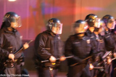 Photo of police standing with batons