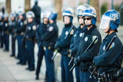 Line of police officers in protective gear