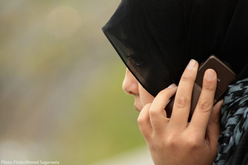 Woman wearing hijab on phone