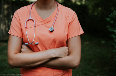 Doctor with arms folded looking defiant