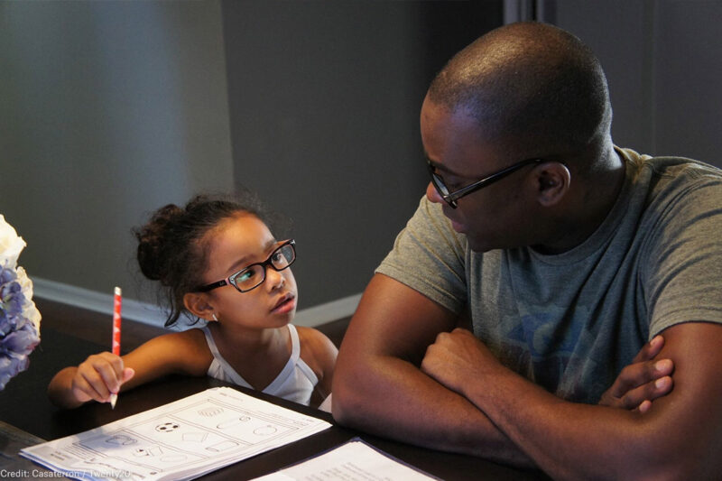 Father and daughter doing homework