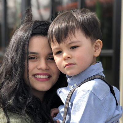 Plaintiff Katia Hills holds her son.