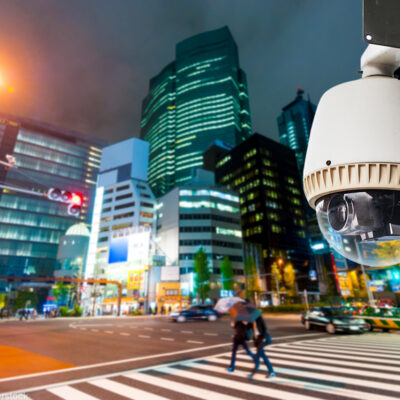 Surveillance camera on a city street at night