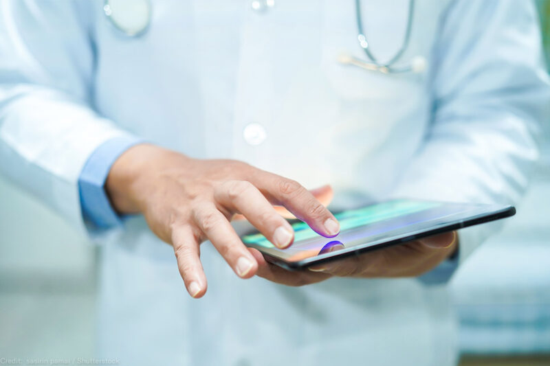 A doctor using a tablet