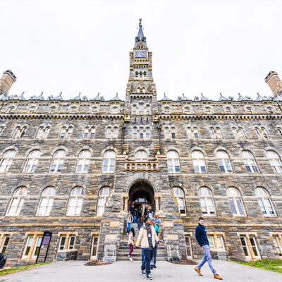 Students exiting a building on the Georgetown University campus.