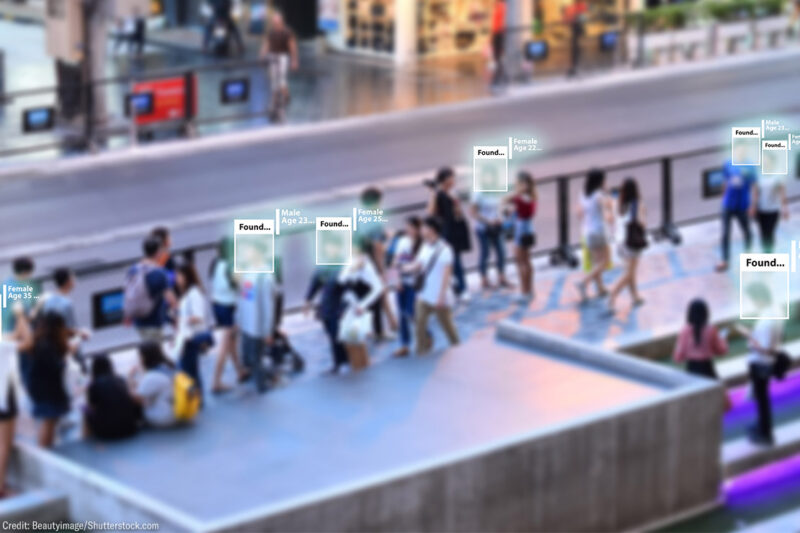 Facial recognition software scanning a crowd.