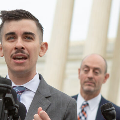ACLU lawyer Chase Strangio speaking outside the Supreme Court.