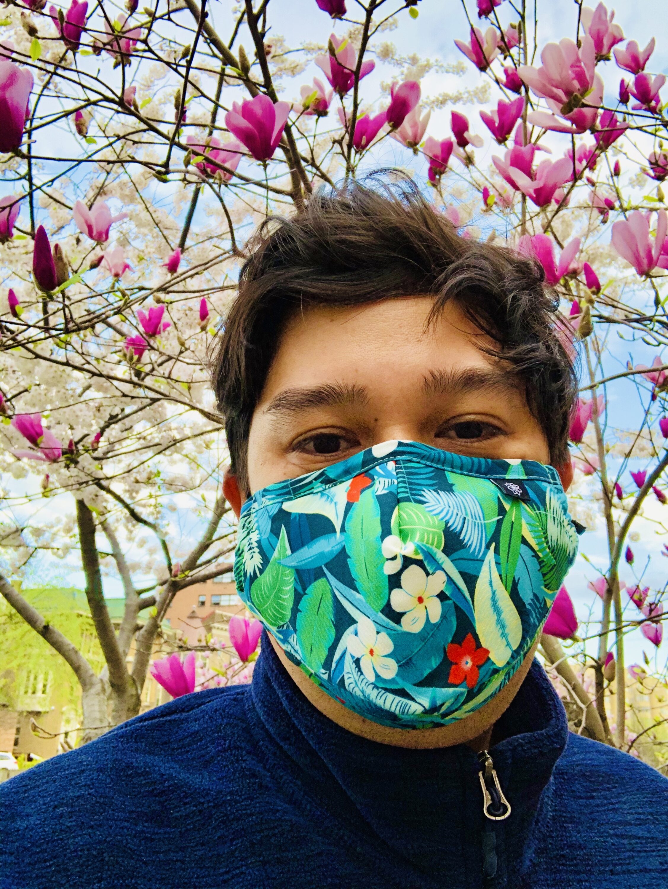 Shige Sakurai with flowering tree in background