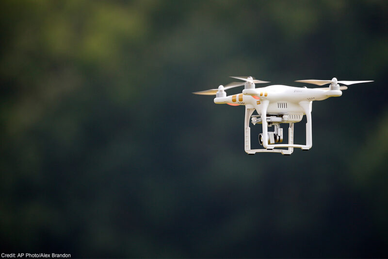 A civilian UAV, or drone, flying outdoors.