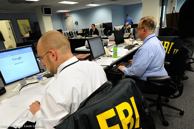 An FBI agent reads through documents.