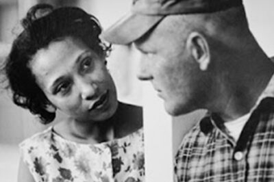 A photo of Mildred and Richard Loving looking at each other.