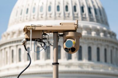 A close-up of a video surveillance unit set up in front of the U.S. Capitol building.