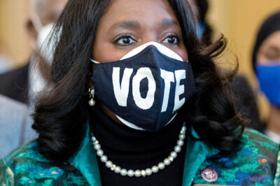 Rep. Terri Sewell wearing a mask that says "Vote."