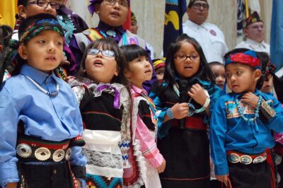 Children from the Zuni Pueblo lead the U.S. pledge of allegiance in the Zuni language in the New Mexico state Capitol in Santa Fe, N.M.