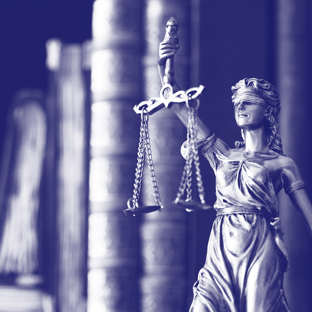 blue photo of lady justice statue