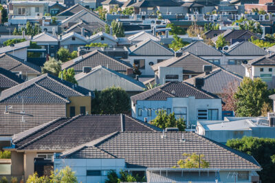A view of a group of house roofs.