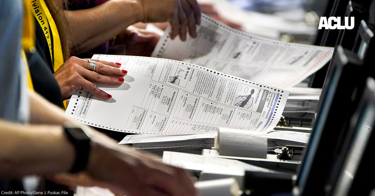 Election workers handle ballots at the Allegheny County Election Division warehouse in Pittsburgh.