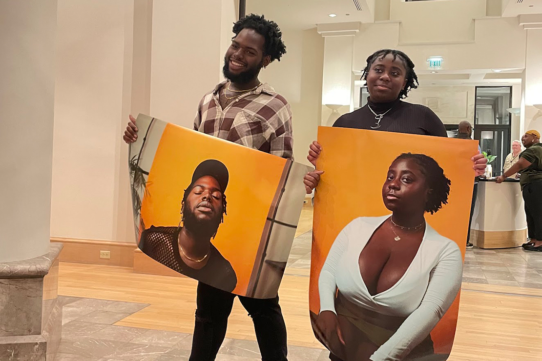 DaQuon and Peyton holding up portaits of themselves.