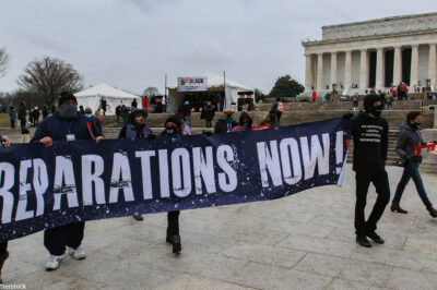Demonstrators with the Reparationist Collective gather at the Lincoln Memorial in Washington, D.C. to demand reparations from slavery and inequity