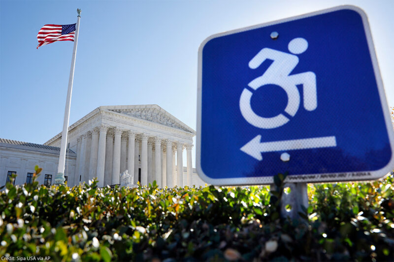 A wheelchair accessibility sign in front of the Supreme Court.