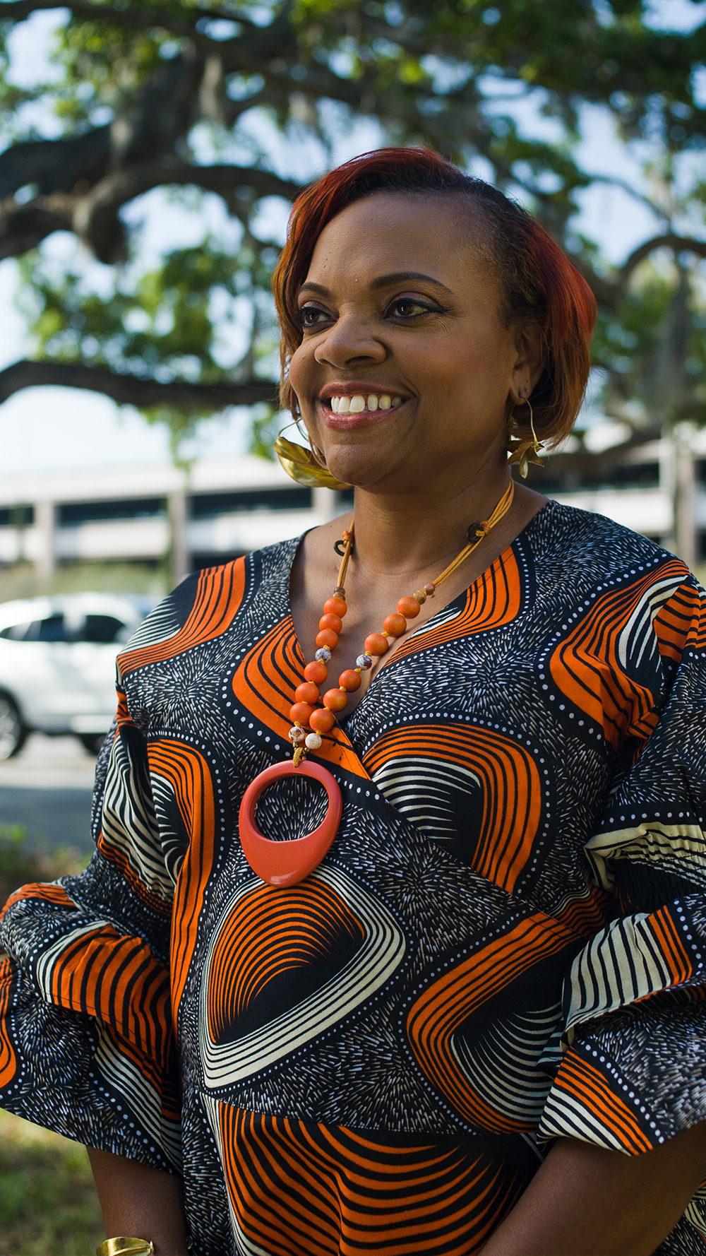 A smiling Dr. Dana Thompson Dorsey standing outside.