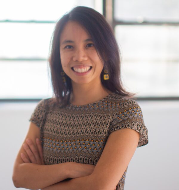 Headshot of attorney Bethany Li smiling with her arms folded across her chest