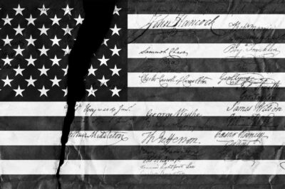 A black and white image of the American flag with distressed details and script on top.