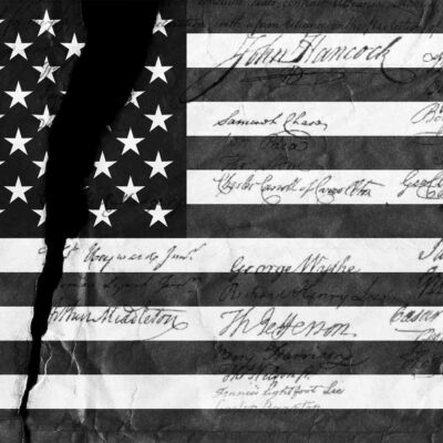 A black and white image of the American flag with distressed details and script on top.