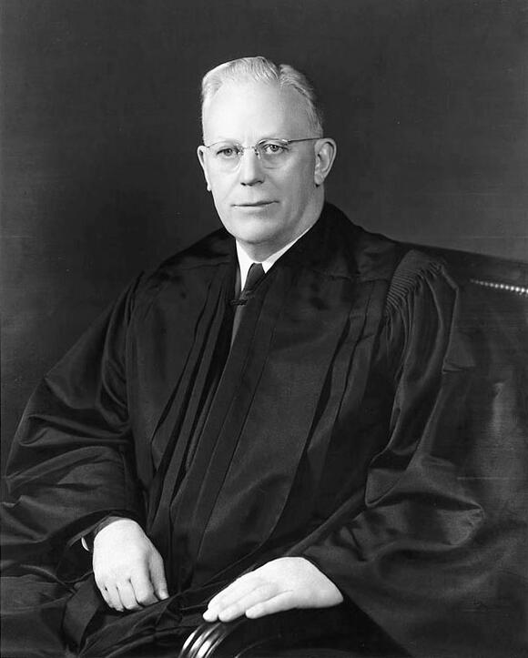 Black and white portrait of Earl Warren