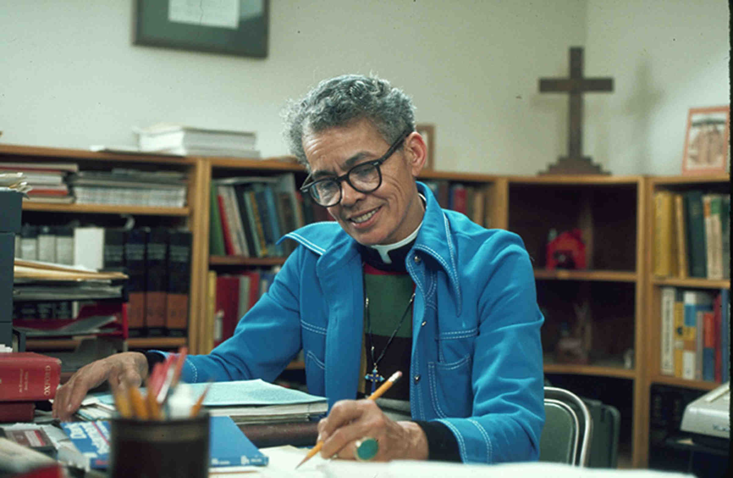 Pauli Murray writing at her desk