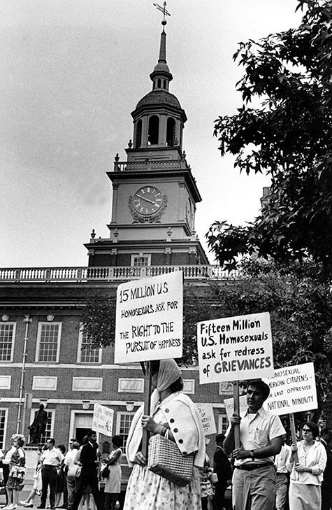 Demonstrators carry signs calling for protection of homosexuals from discrimination as they march in a picket line in front of Independence Hall in Philadelphia, July 4, 1967. (AP Photo/John F. Urwiller)