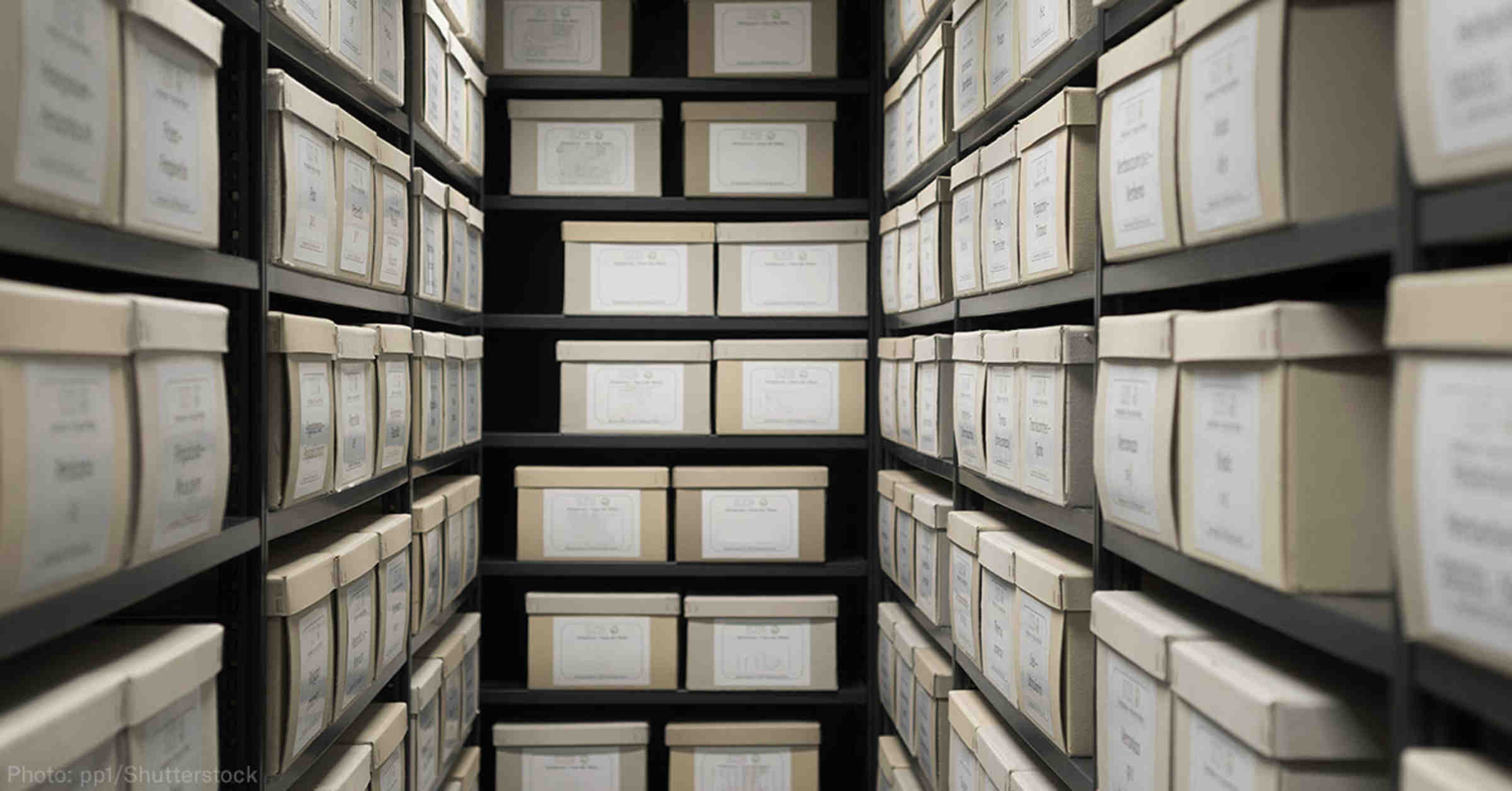 small room with boxes of documents