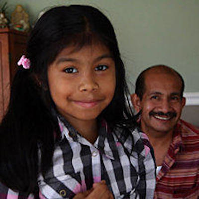 A photograph of a girl and her father.