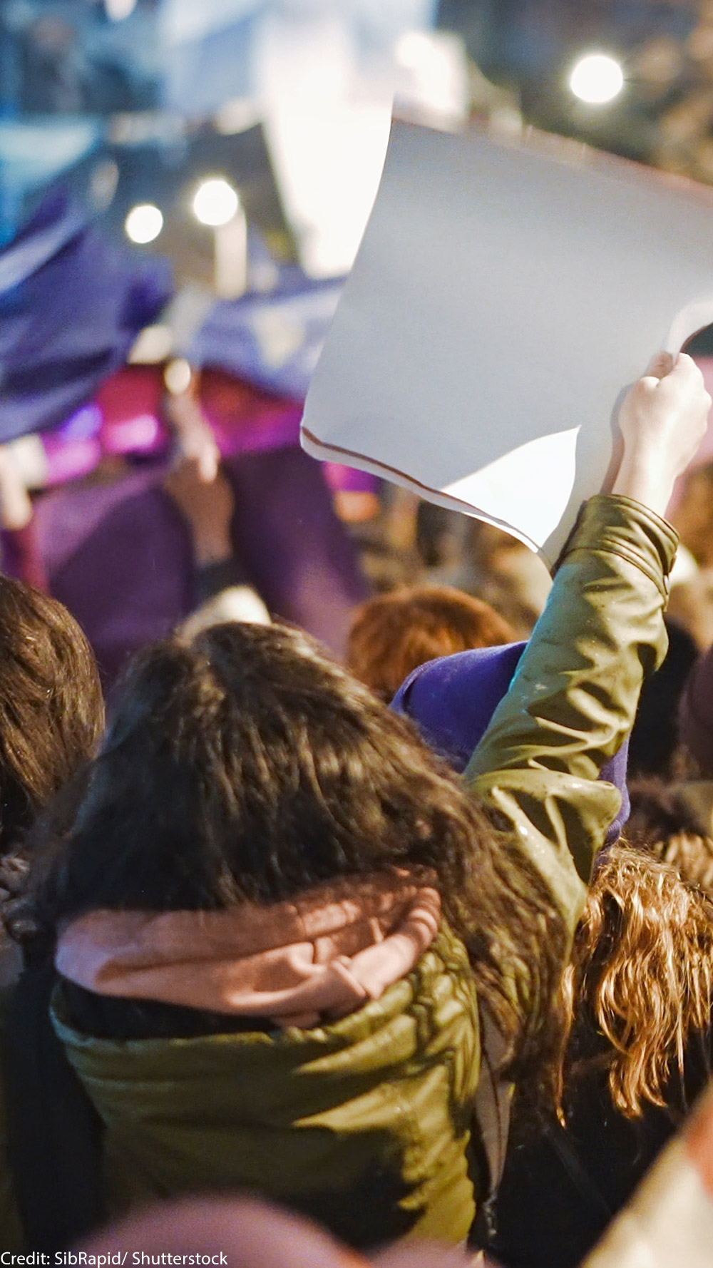 A backward view of protesters.