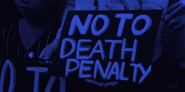 A graphic that includes a sign that says "No To The Death Penalty."