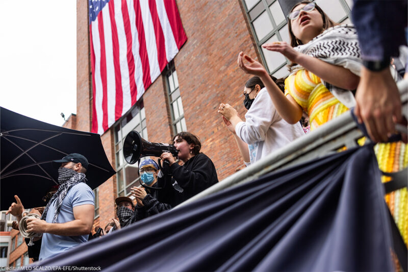 Pro-Palestinian protesters sing in the ongoing student encampment of pro-Palestinian supporters in the University Yard at George Washington University in Washington, DC.