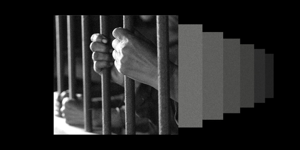 A graphic depicting an individual's hands holding prison bars.